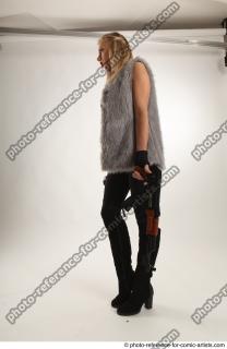 11 2018 01 NIKOL STANDING POSE WITH GUNS